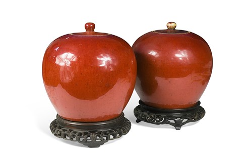 Lot 26 - A pair of Chinese sang de boeuf ovoid jars and covers, Qing Dynasty circa 1800-1820