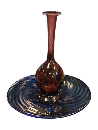 Lot 12 - A deep blue swirled glass charger (stamped to...