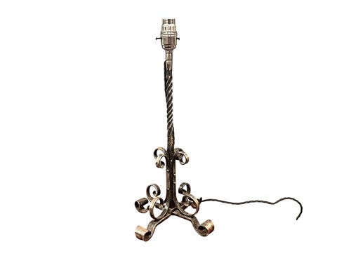 Lot 674 - An Arts & Crafts blackened steel table lamp,...