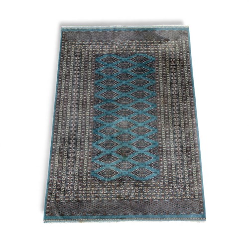 Lot 819 - A Bokhara teal rug 184 x 123cm