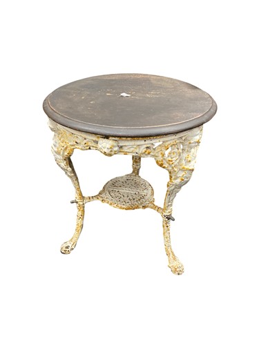 Lot 830 - A white painted cast iron pub table, decorated...