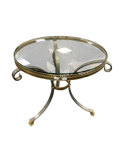 Lot 831 - A brass and glass circular table, with pierced...