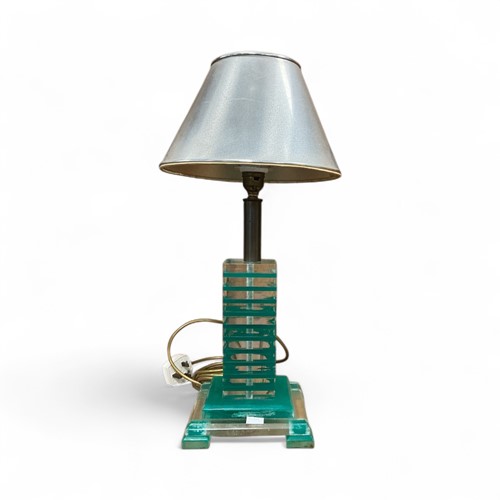 Lot 254 - A lucite table lamp, banded in clear and...