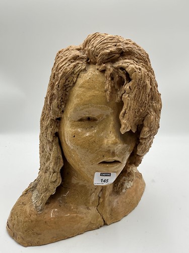Lot 101 - A glazed terracotta head of a woman 37cm high