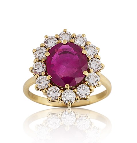 Lot 142 - A Burmese ruby and diamond cluster ring
