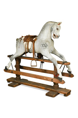 Lot 679 - A painted wooden rocking horse, early 20th century