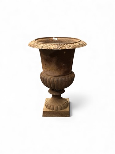 Lot 801 - A cast iron urn, in two parts, with flared rim...