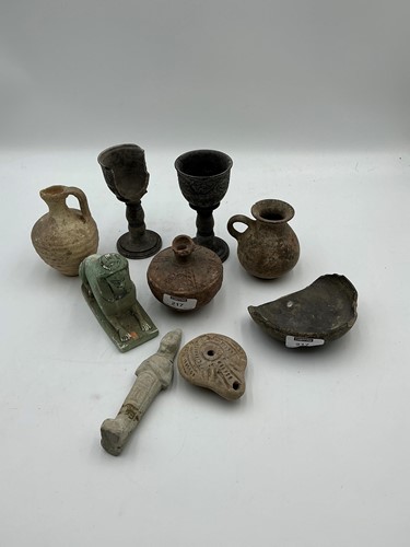 Lot 217 - A group of Roman antiquities including an oil...
