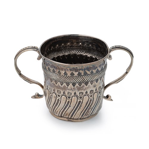 Lot 294 - A Queen Anne Britannia silver two handled porringer