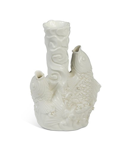 Lot 17 - A Chinese blanc de chine model of two leaping carp