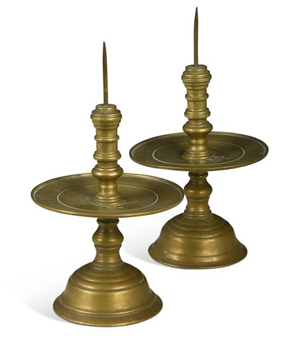 Lot 63 - A pair of Buddhist bronze pricket candlesticks, 19th or early 20th century