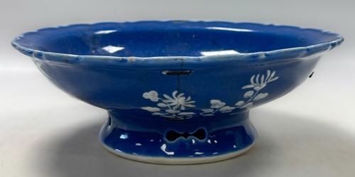 Lot 13 - A footed shallow bowl in blue overall glaze