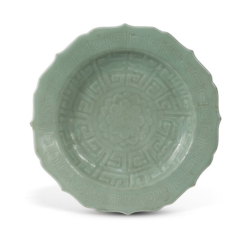 Lot 24 - A footed shallow bowl in celadon glaze
