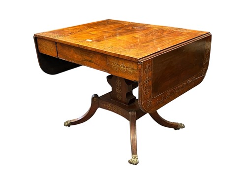 Lot 709 - A Regency rosewood and brass inlaid sofa table...