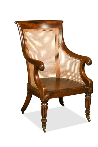 Lot 464 - A William IV caned mahogany bergère library armchair