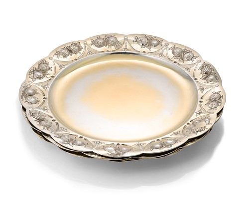 Lot 372 - Three Elizabeth II embossed silver gilt plates