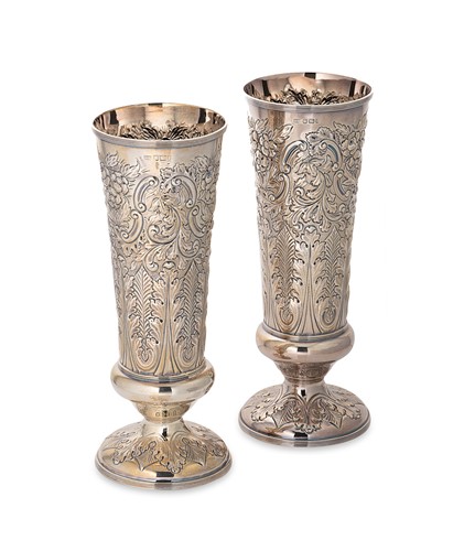Lot 329 - A pair of Victorian embossed silver vases