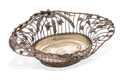 Lot 297 - A George III silver bread or fruit swing-handle basket