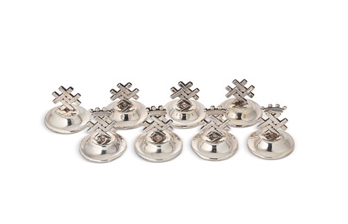 Lot 315 - A set of eight 19th century white metal menu holders