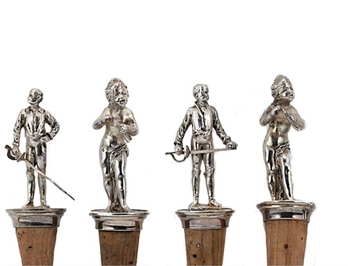 Lot 201 - A set of four white metal figural bottle stoppers