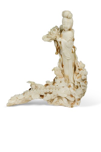 Lot 19 - A Chinese carved white coral one-piece figure