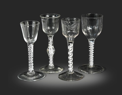 Lot 647 - Four George III air twist wine glasses