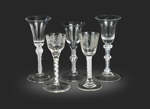 Lot 646 - Five George III air twist wine glasses