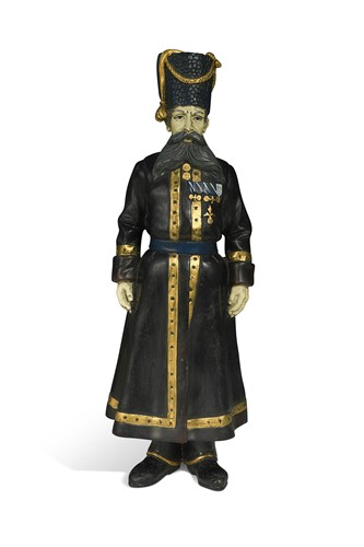Lot 535 - In the manner of Faberge, a Russian cold-painted bronze model of a Cossack, early 20th century