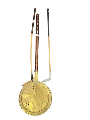 Lot 225 - Two early golf clubs together with a brass...