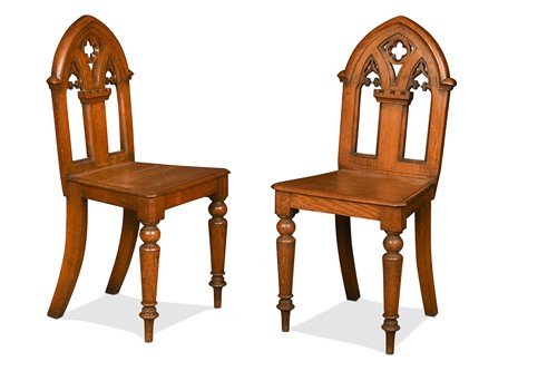 Lot 664 - A pair of Victorian Gothic oak hall chairs