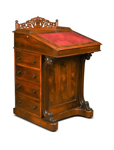 Lot 617 - A Victorian rosewood davenport with pop-up top