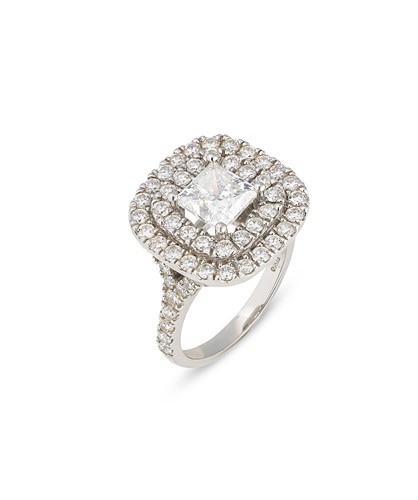 Lot 78 - A princess cut diamond double halo style ring