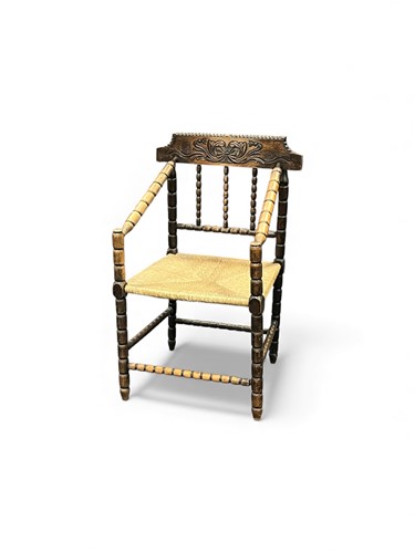 Lot 779 - A turned beech frame 'thrown' chair, with rush...