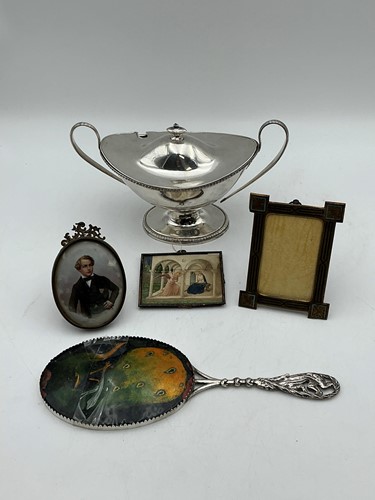 Lot 168 - An Art Nouveau hand mirror with enamel peacock...