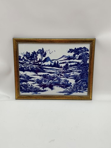 Lot 200 - A blue and white framed tile, figures hunting...