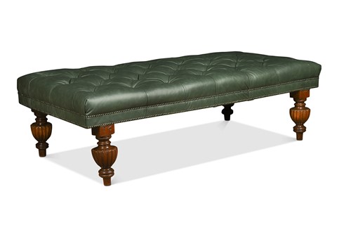Lot 552 - A large green leather button upholstered stool, adapted