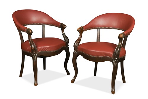 Lot 648 - A pair of Victorian leather upholstered tub chairs