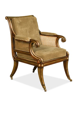 Lot 475 - A faux-rosewood and parcel-gilt bergère library armchair, by Julian Chichester
