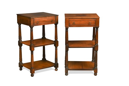 Lot 673 - A pair of George III style mahogany three tier lamp tables, 20th century