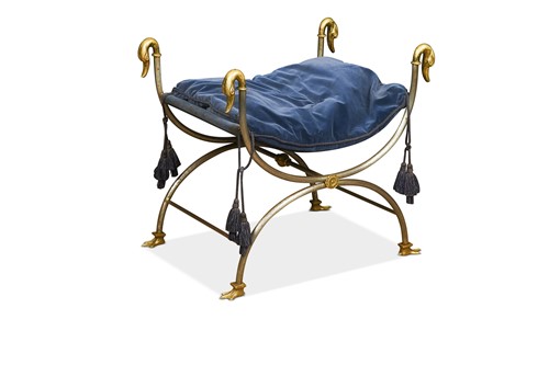 Lot 570 - A steel and brass X-frame stool, 20th century