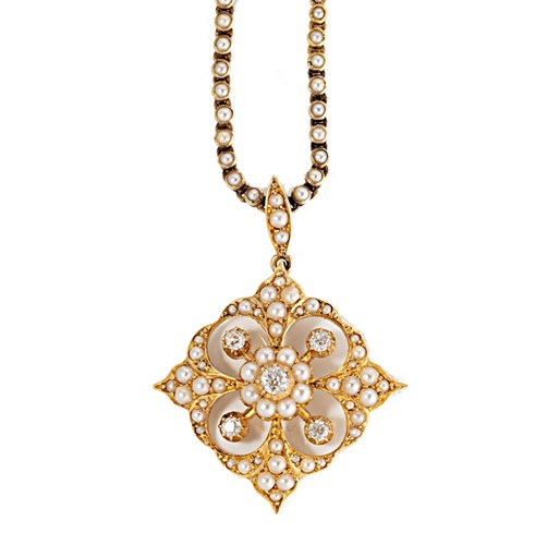 Lot 131 - An Edwardian split pearl and diamond pendant and chain