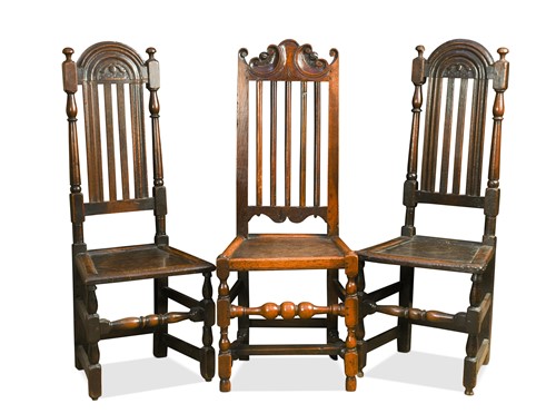 Lot 357 - Two oak panelled high back chairs, 17th century