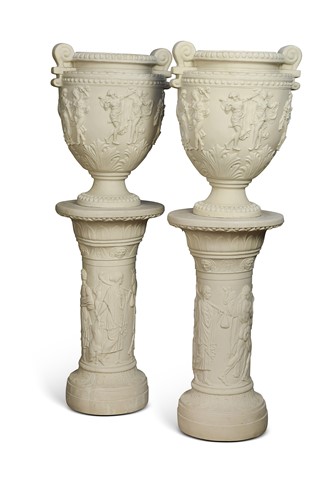 Lot 444 - A pair of classical style marble effect resin urns on pedestals, late 20th century