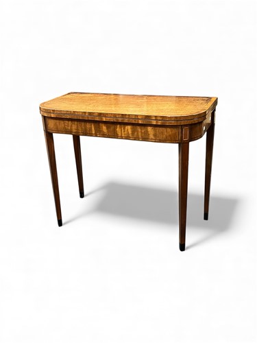 Lot 728 - A late George III mahogany card table, the...