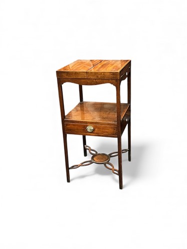 Lot 646 - A George III mahogany washstand, the twin...