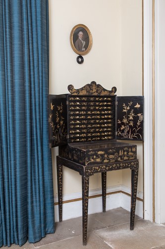 Lot 491 - A Chinese Export black lacquer cabinet on stand, early 19th century