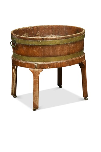 Lot 410 - A George III mahogany and brass-bound oval wine cooler