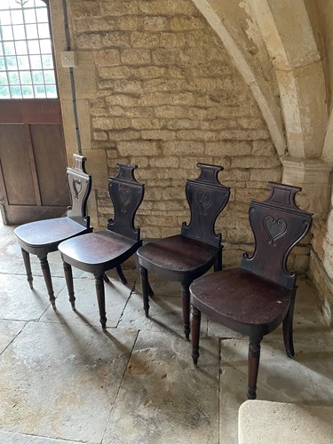 Lot 385 - A set four Regency mahogany hall chairs