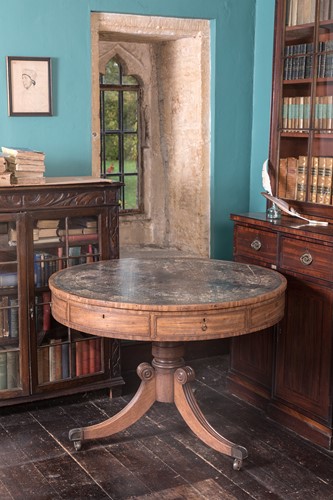 Lot 437 - A Regency drum top library table