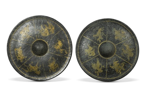 Lot 54 - A pair of black and gilt painted South East Asian circular shields, 19th century